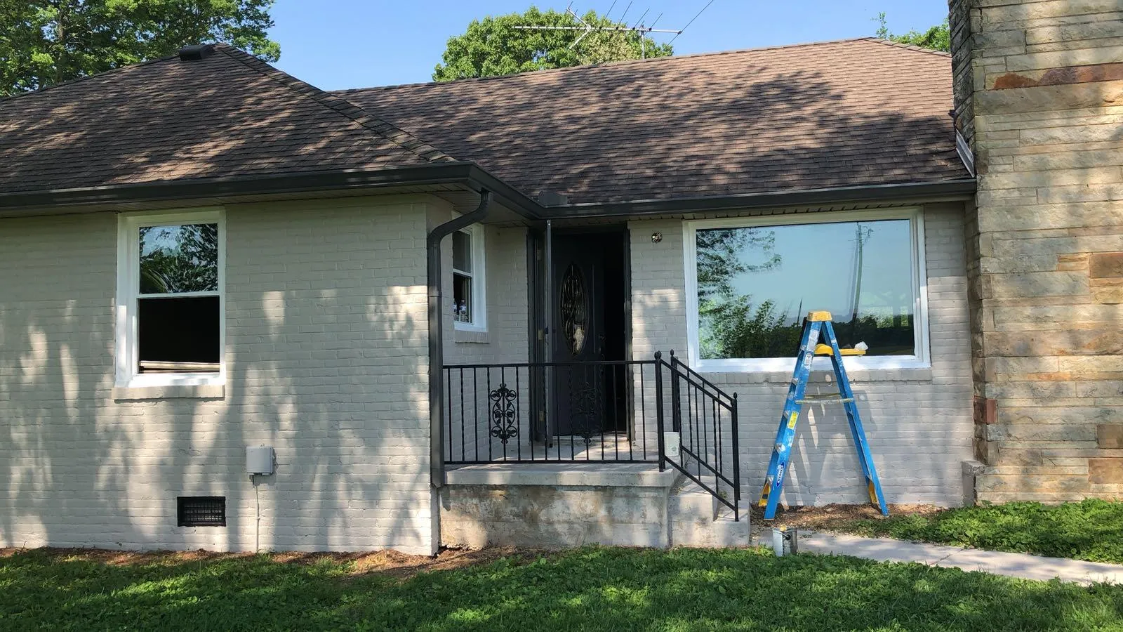 After — Brick ranch repaint, red brick to greige
