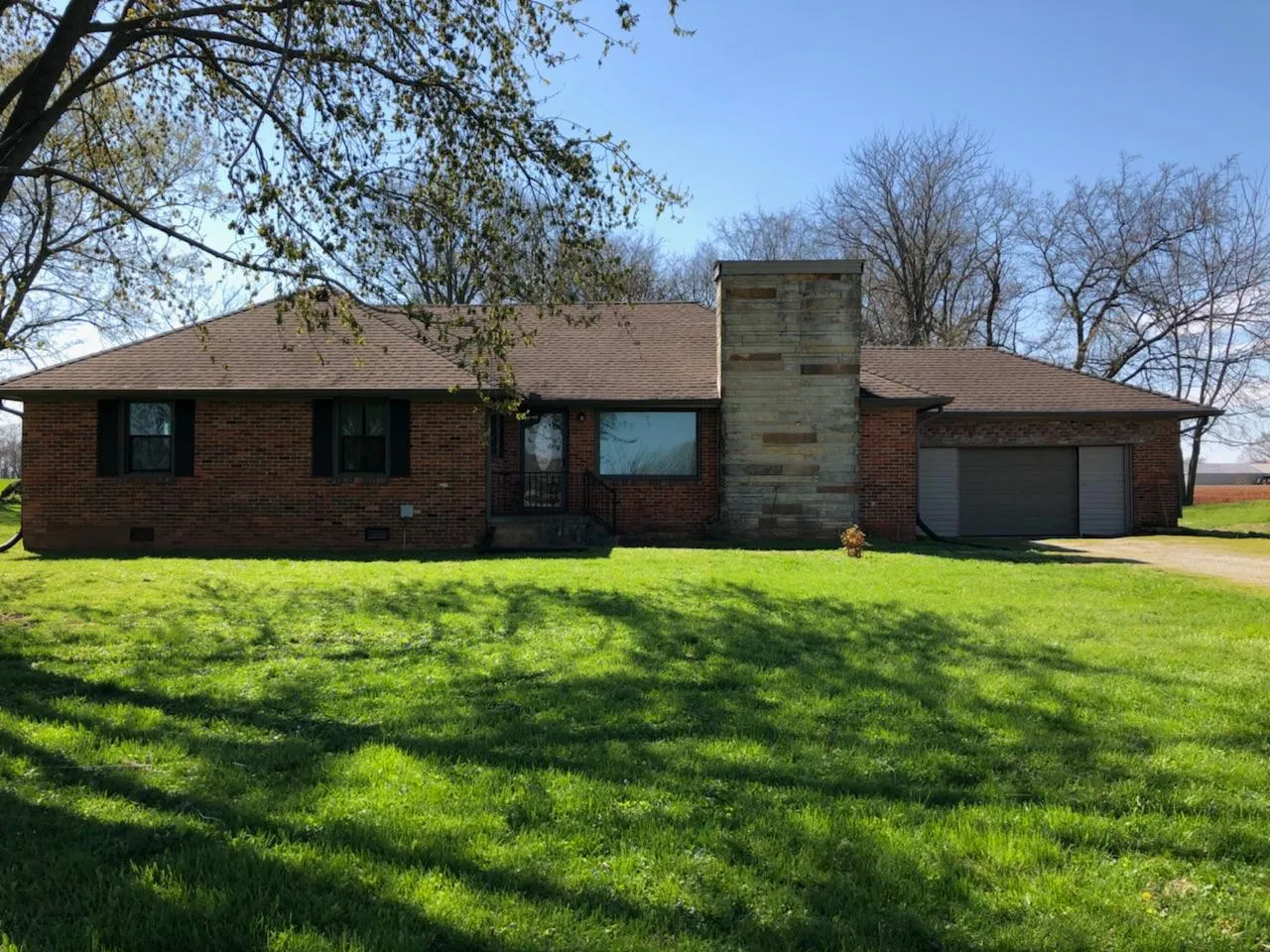 Before — Brick ranch repaint, red brick to greige