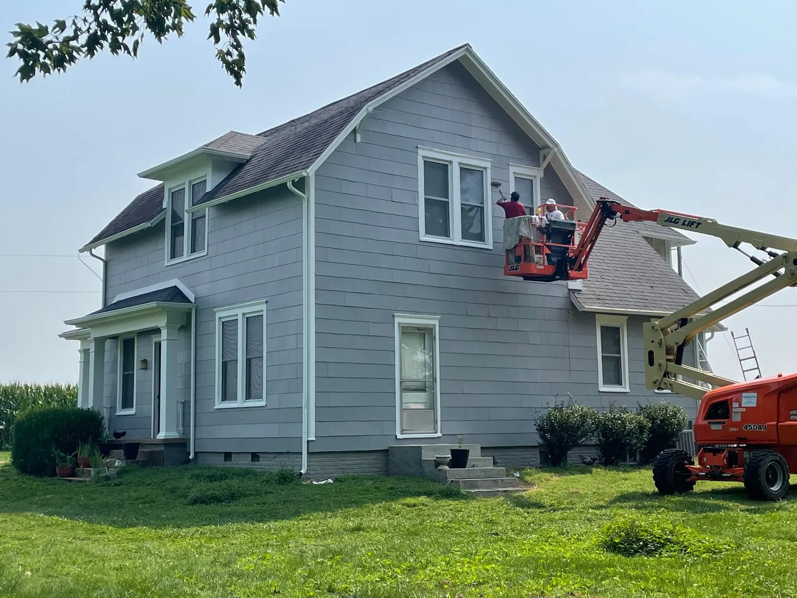 Two-story farmhouse exterior repaint